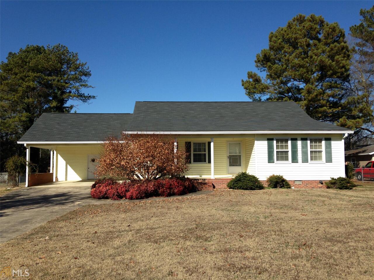 102 Eden Drive Northwest Rome, GA 30165 - Photo 1 of 1 front view of a house with a patio