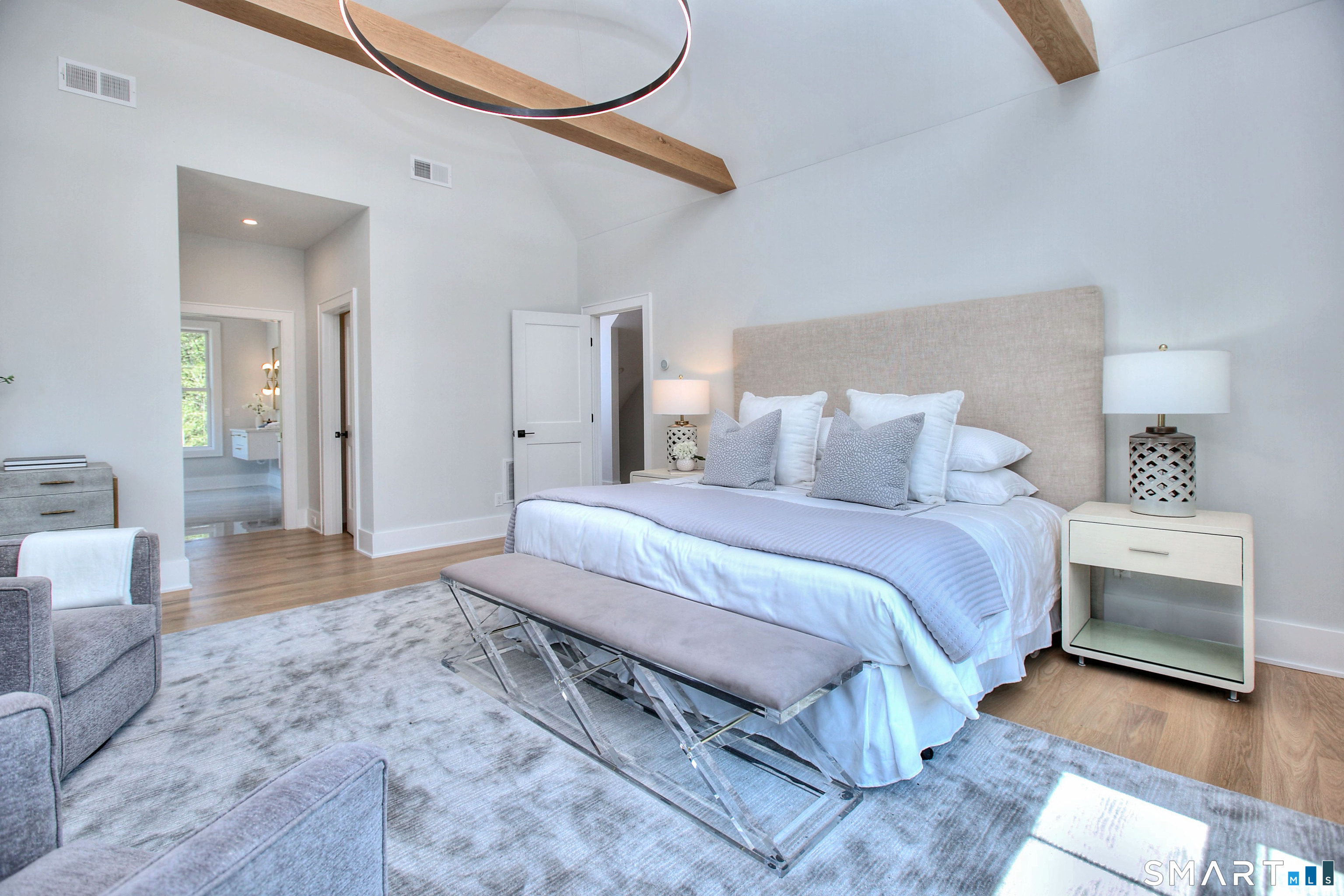 20 Fresenius Road Westport, CT 06880 - Photo 11 of 18 a spacious bedroom with a bed and a couch