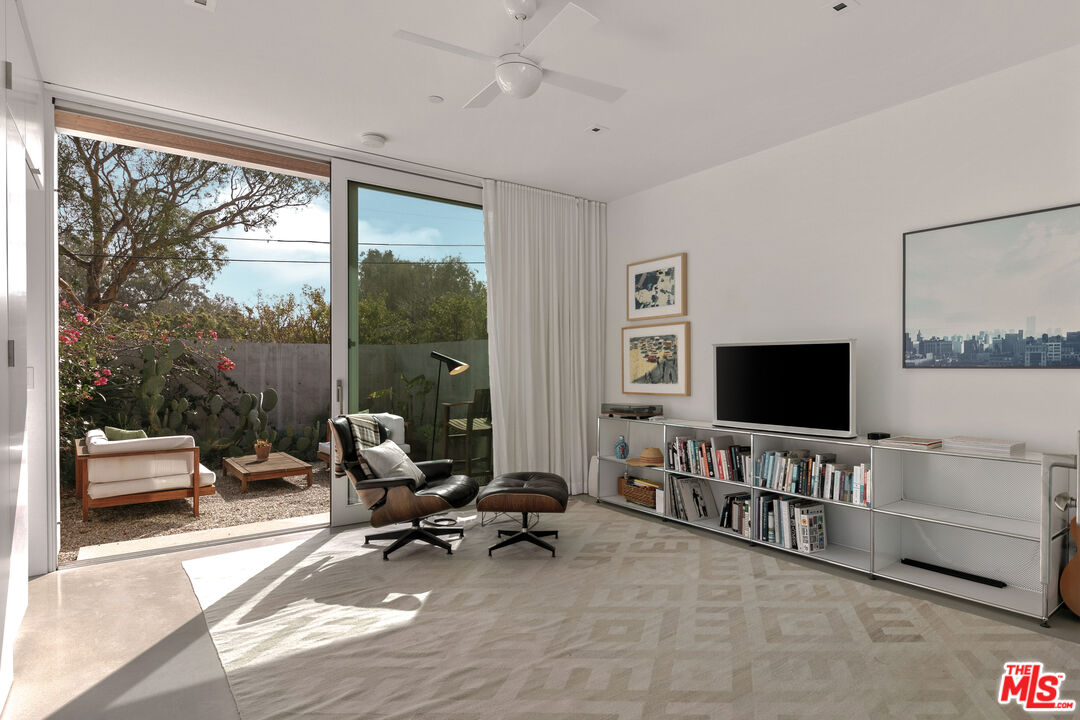 6728 Wildlife Road Malibu, CA 90265 - Photo 26 of 57 a view of a livingroom with workspace and a large window