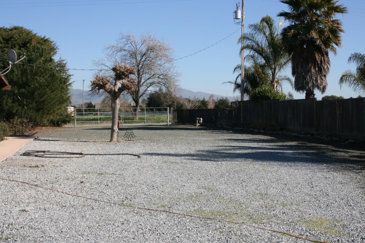 1738 H Santa Ana Road, Unit H Hollister, CA 95023 - Photo 13 of 33 a view of backyard space with palm trees