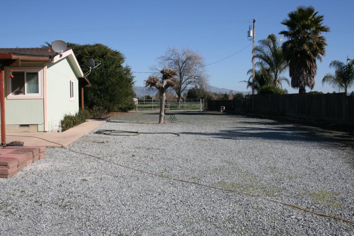 1738 H Santa Ana Road, Unit H Hollister, CA 95023 - Photo 14 of 33 a view of a house with a backyard