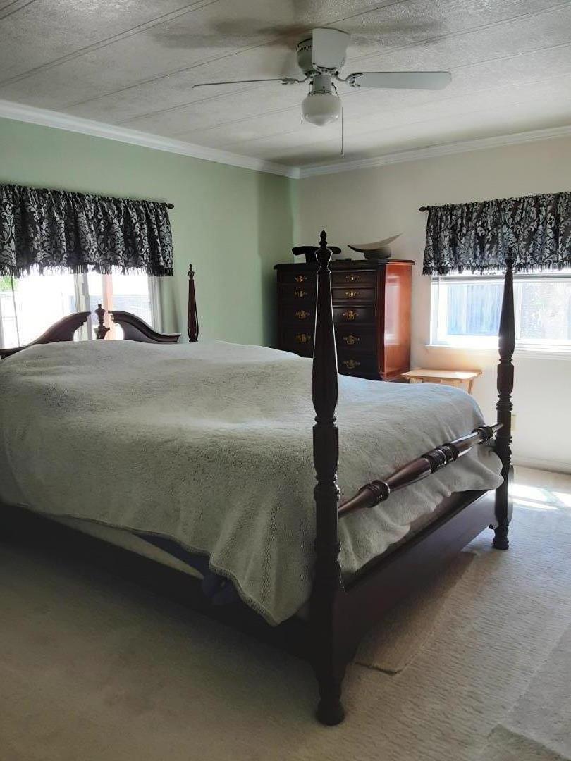 1738 H Santa Ana Road, Unit H Hollister, CA 95023 - Photo 32 of 33 a bedroom with a bed and window