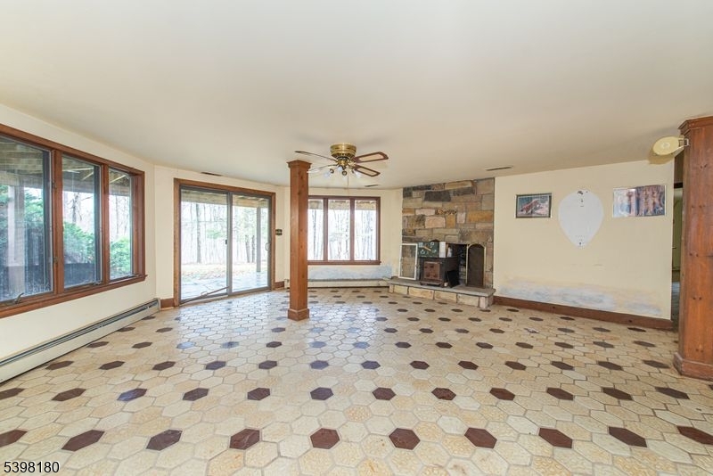 24 Wehrli Road Long Valley, NJ 07853 - Photo 12 of 16 a big room with windows and chandelier