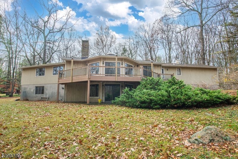 24 Wehrli Road Long Valley, NJ 07853 - Photo 13 of 16 a house with trees in front of it