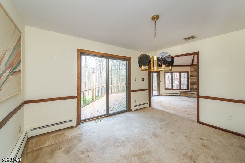 24 Wehrli Road Long Valley, NJ 07853 - Photo 4 of 16 a view of a room with staircase ceiling fan