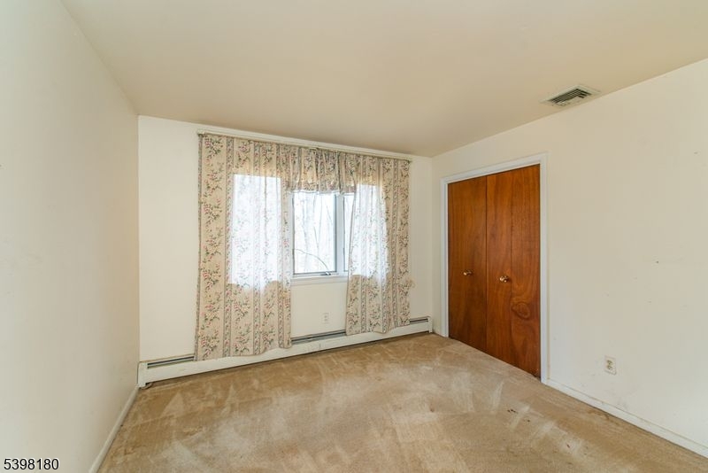 24 Wehrli Road Long Valley, NJ 07853 - Photo 6 of 16 an empty room with windows