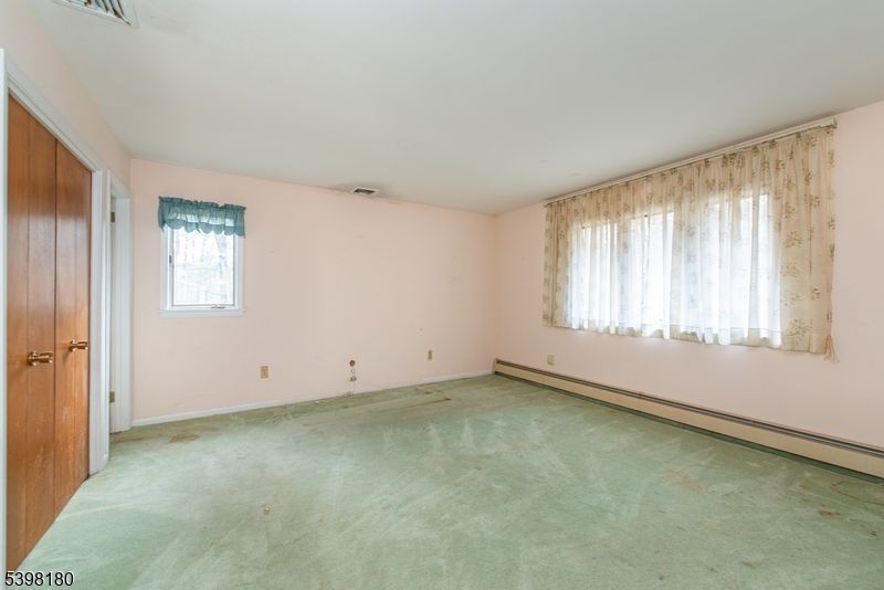 24 Wehrli Road Long Valley, NJ 07853 - Photo 8 of 16 an empty room with windows