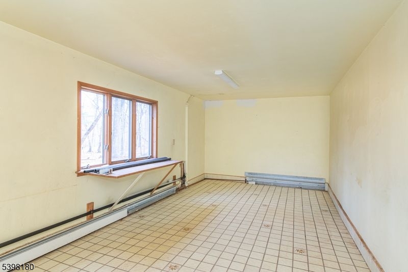 24 Wehrli Road Long Valley, NJ 07853 - Photo 10 of 16 a view of a room with wooden floor and cabinet