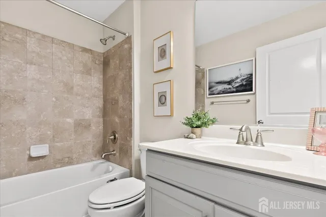 a bathroom with a sink a toilet and a bathtub