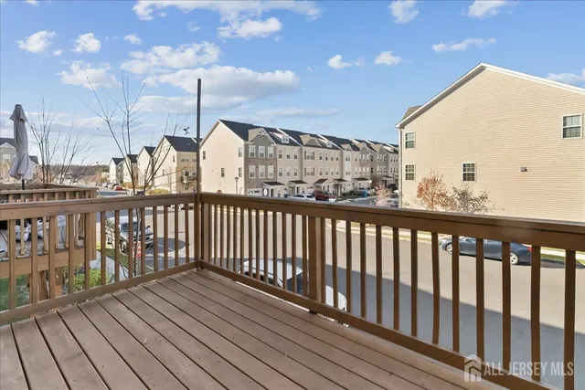 a view of a balcony with wooden floor