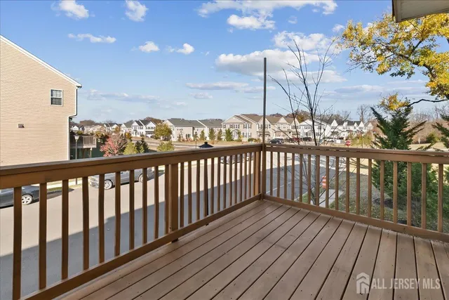 a view of a balcony with wooden floor