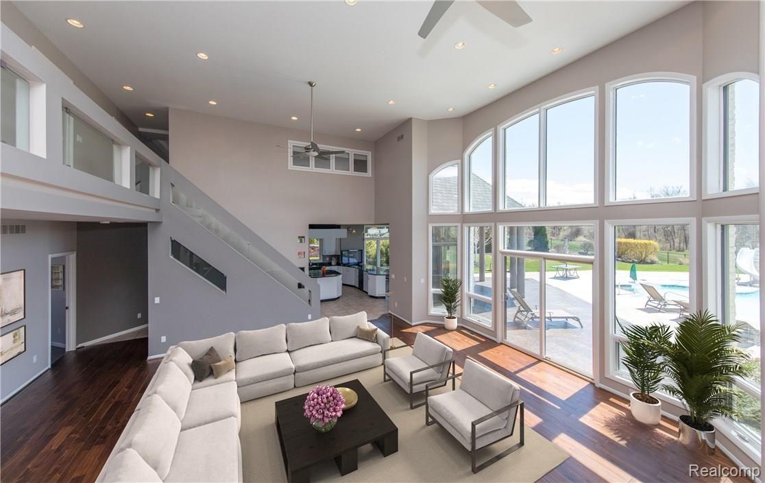 7821 High Ridge Court Clarkston, MI 48348 - Photo 21 of 47 Floor to Ceiling Windows allow Natural Light to infuse living space