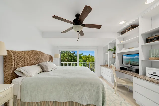 a large white bed in a white room