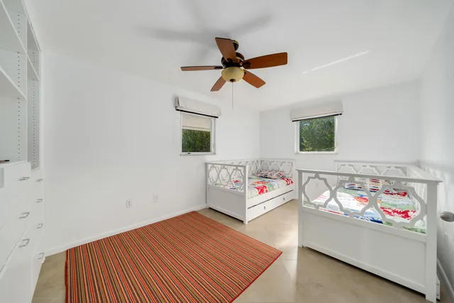 a bedroom with furniture and a window