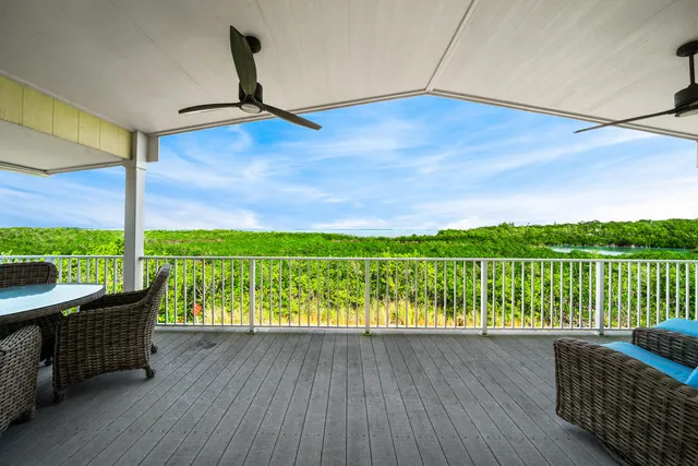 a view of balcony with furniture