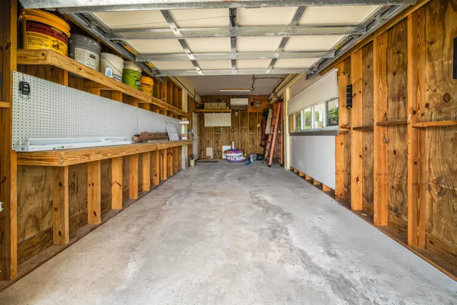 a view of a swimming pool with a lounge chairs and backyard
