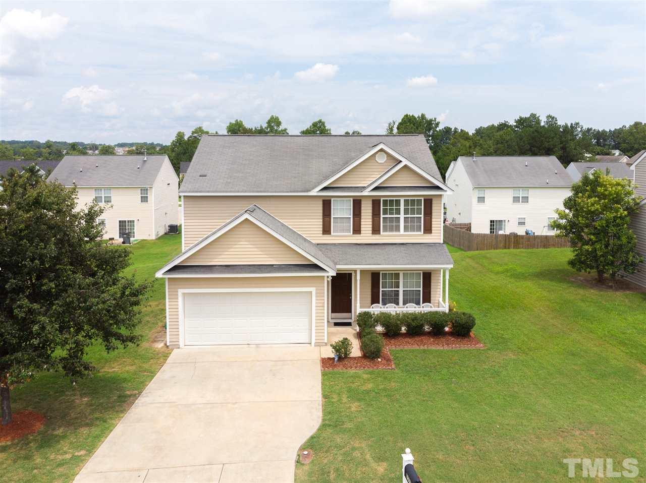 7029 Spanglers Spring Way Raleigh, NC 27610 - Photo 2 of 18 a front view of a house with a yard