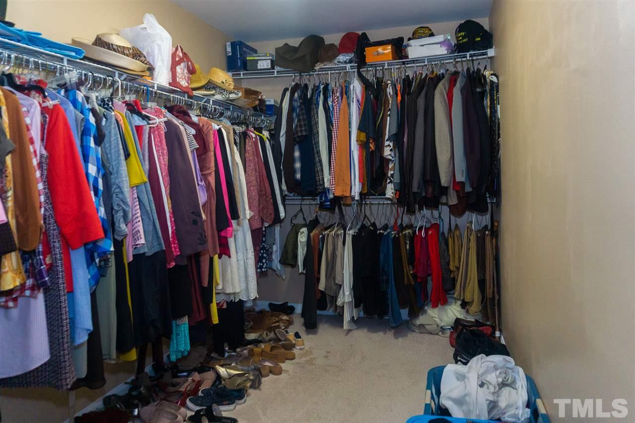 7029 Spanglers Spring Way Raleigh, NC 27610 - Photo 11 of 18 a view of walk in closet with clothes