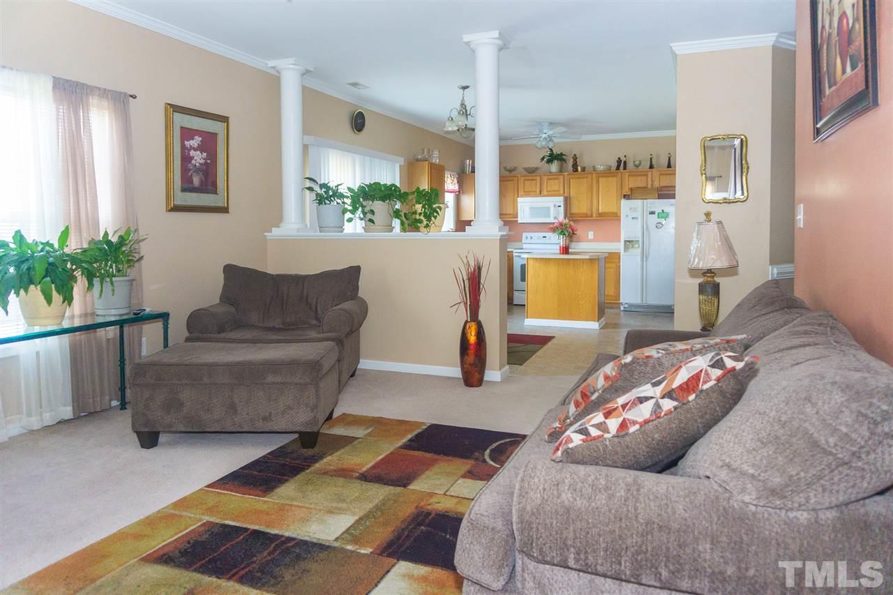 7029 Spanglers Spring Way Raleigh, NC 27610 - Photo 3 of 18 a living room with furniture and a couch