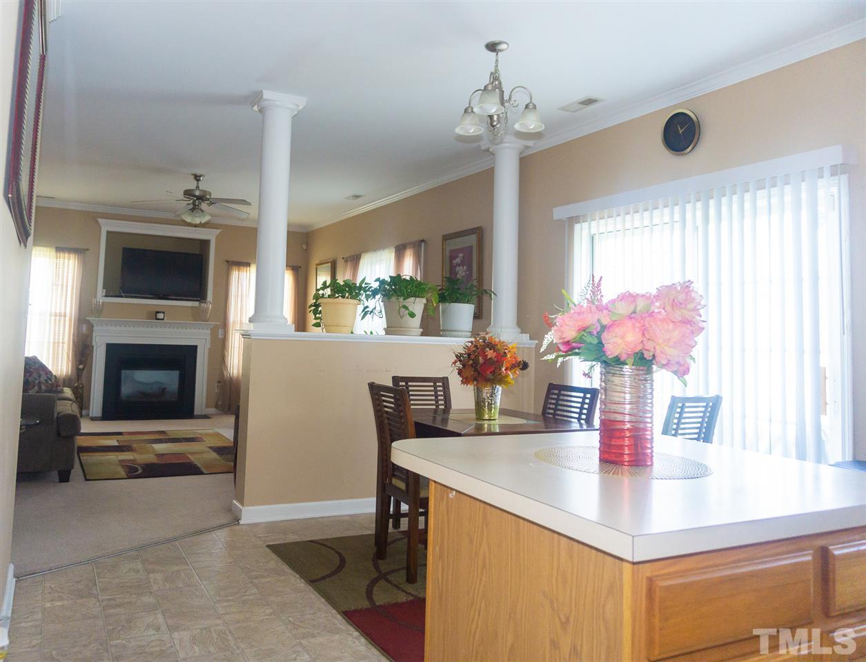 7029 Spanglers Spring Way Raleigh, NC 27610 - Photo 5 of 18 a dining room with furniture and window