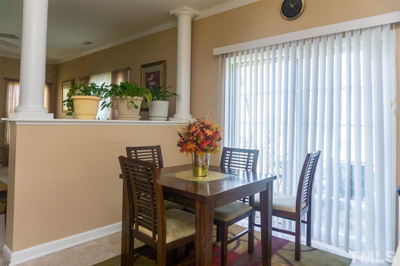 7029 Spanglers Spring Way Raleigh, NC 27610 - Photo 7 of 18 a dining room with furniture and window
