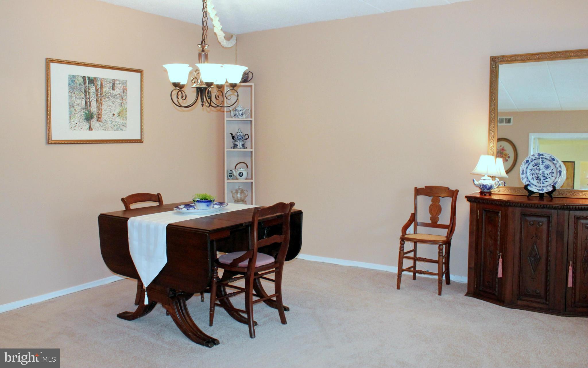 5643 Harpers Farm Road, Unit A Columbia, MD 21044 - Photo 13 of 25 a view of a dining room with furniture