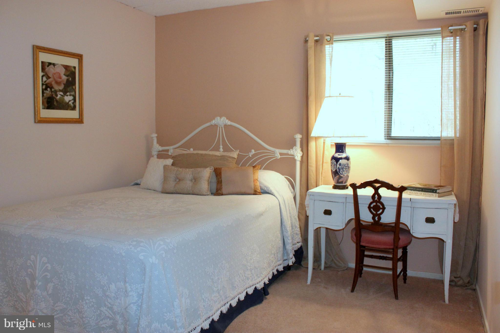 5643 Harpers Farm Road, Unit A Columbia, MD 21044 - Photo 19 of 25 a bedroom with a bed and a window
