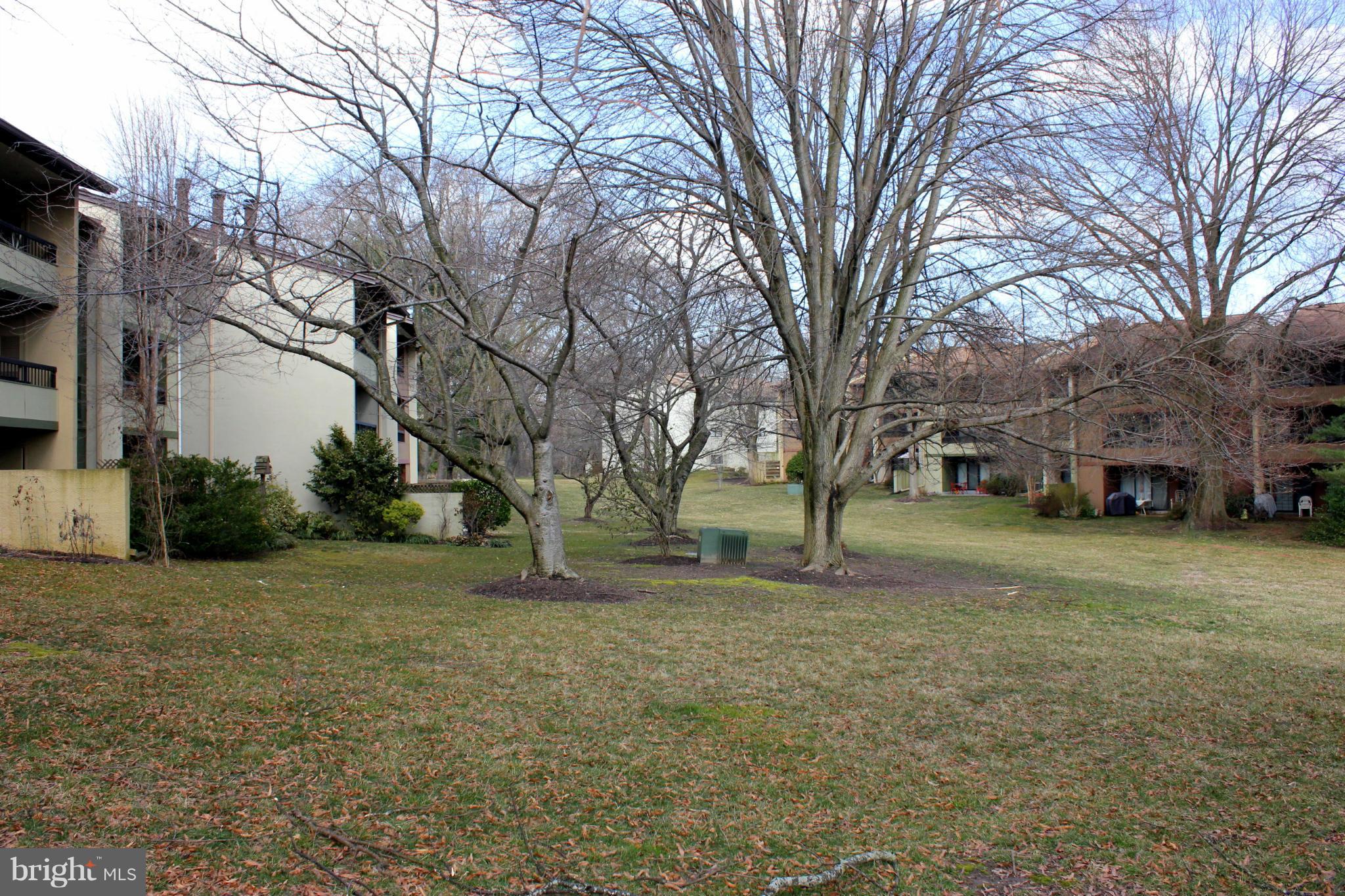5643 Harpers Farm Road, Unit A Columbia, MD 21044 - Photo 25 of 25 a view of a house with a yard