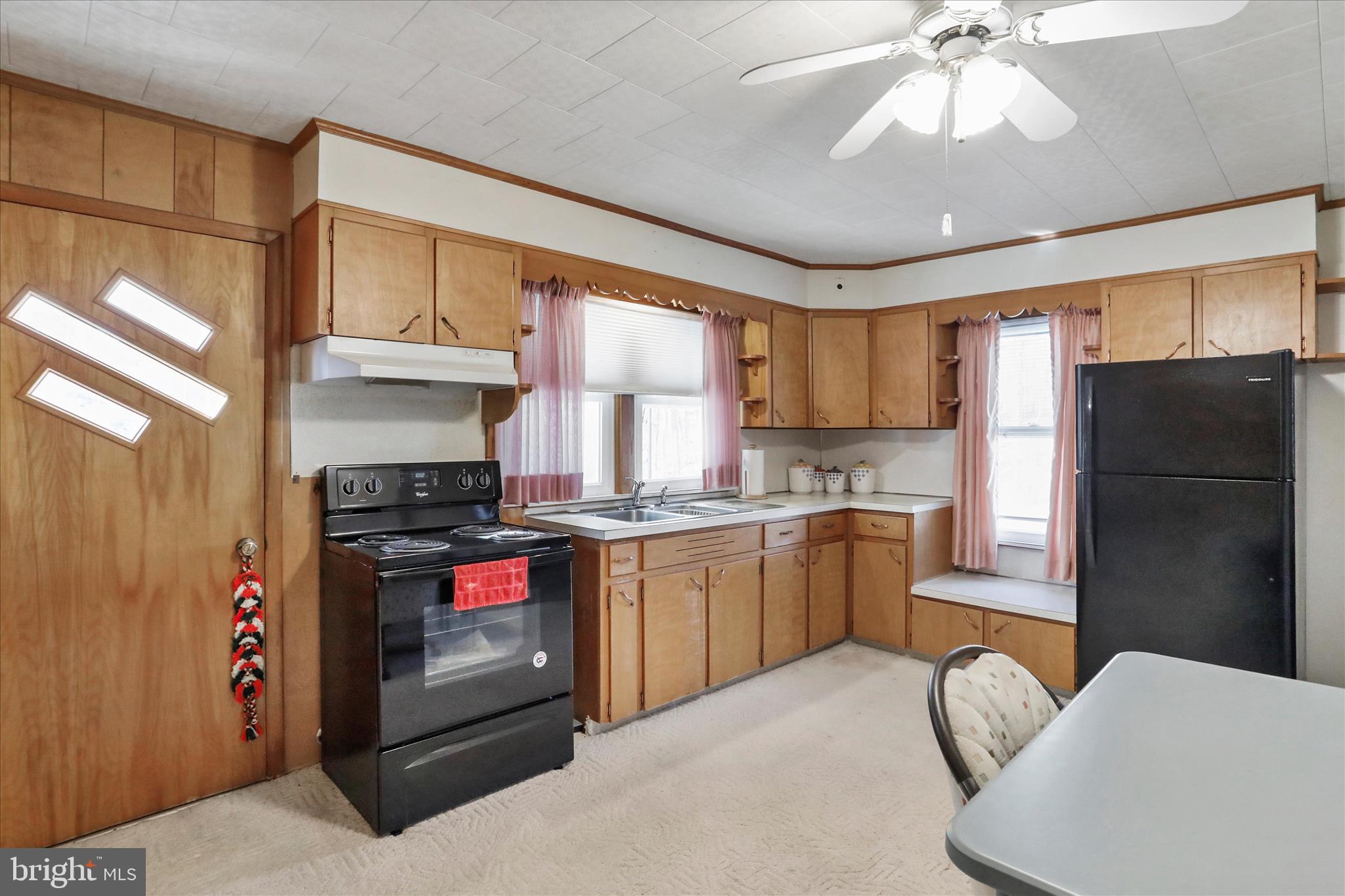14111 Green Ridge Road Northeast Flintstone, MD 21530 - Photo 13 of 24 a kitchen with stainless steel appliances granite countertop a refrigerator and a stove top oven