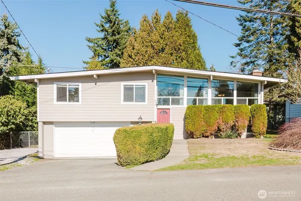 front view of a house with a garden