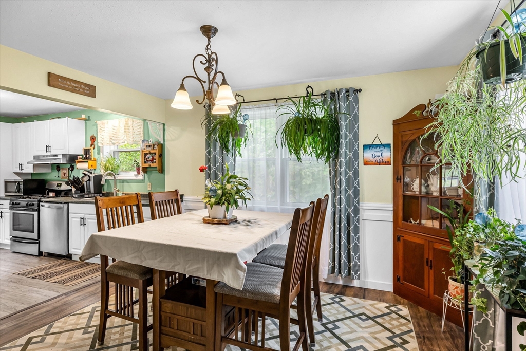 302 Middlefield Road Chester, MA 01011 - Photo 11 of 42 a dining room with furniture and a potted plant