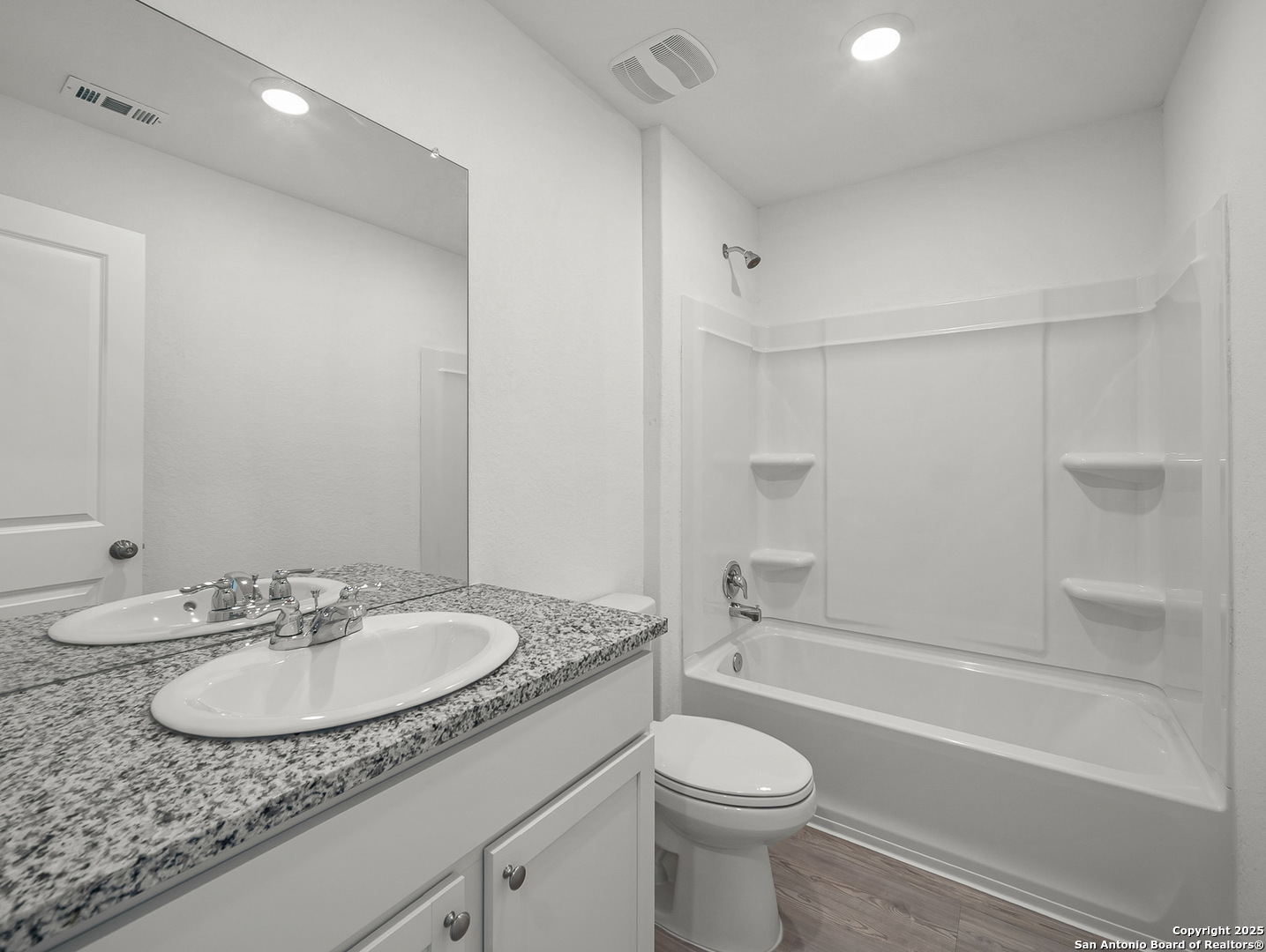 8842 Barrow Path Converse, TX 78109 - Photo 31 of 36 a bathroom with a granite countertop sink toilet and shower