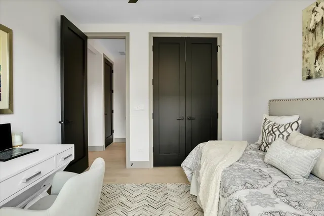 a bedroom with a bed and a television