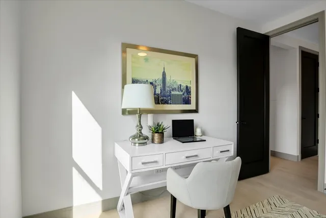 a view of a workspace with furniture