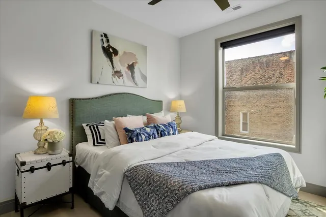 a bedroom with a bed and window