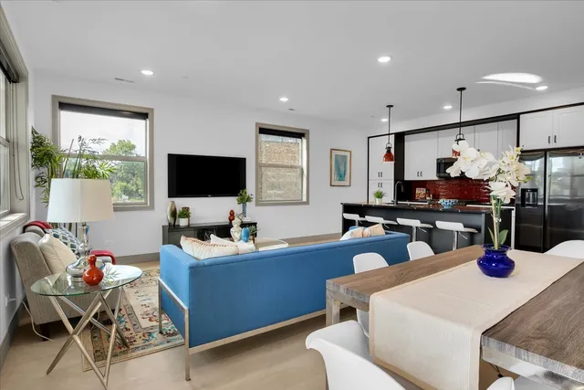 a kitchen with a dining table and chairs