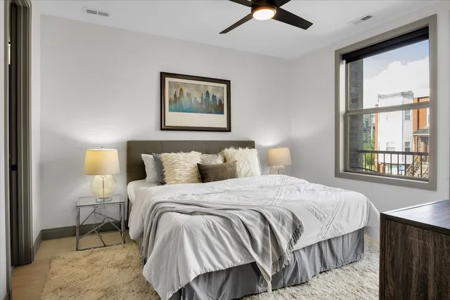 a bedroom with bed and window