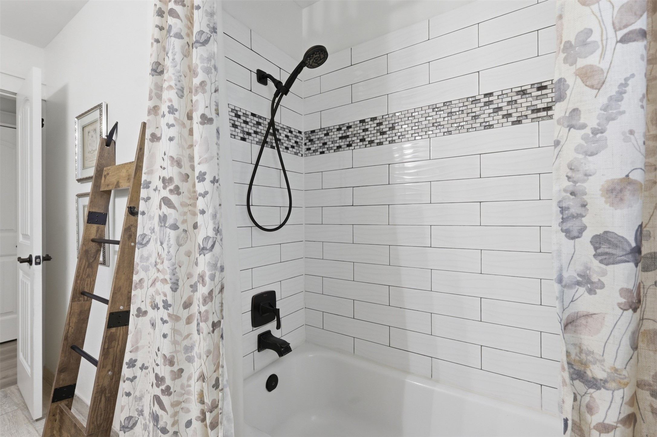 5111 Brookside Road Pearland, TX 77581 - Photo 22 of 42 This bathroom features a recently updated shower with modern finishes, creating a refreshed and inviting space.