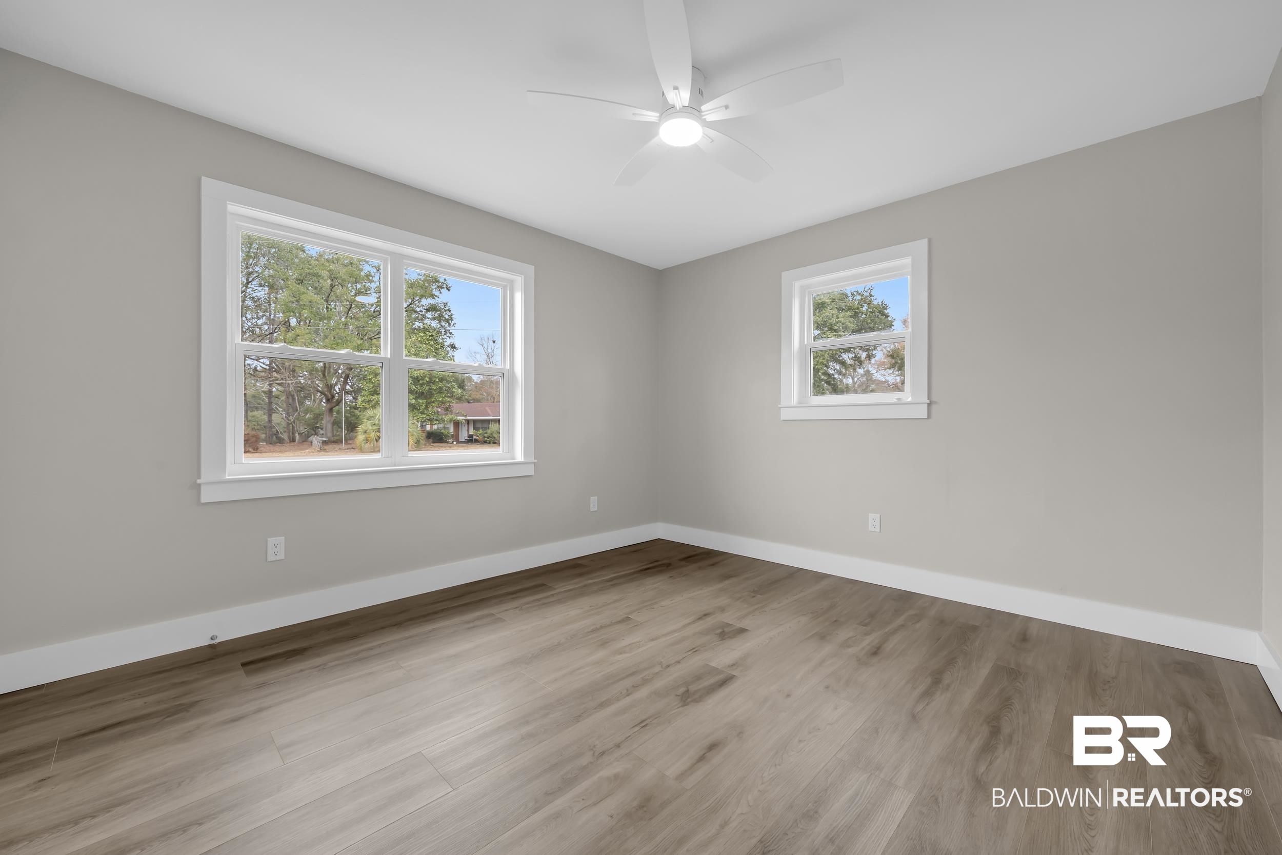 11381 Normandy Drive East Semmes, AL 36575 - Photo 14 of 23 Spare room featuring light wood-type flooring and ceiling fan