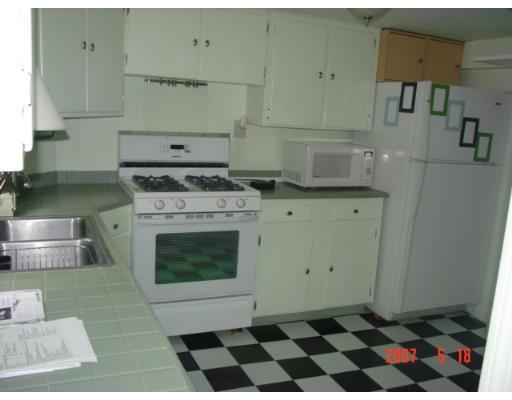 5 South Webster Street Haverhill, MA 01835 - Photo 2 of 8 a kitchen with a stove top oven sink and cabinets