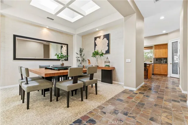 a kitchen with stainless steel appliances granite countertop a refrigerator sink and cabinets