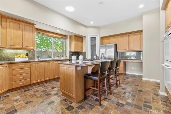 a utility room with cabinets washer and dryer