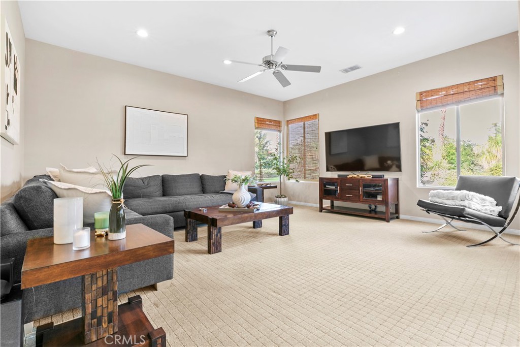 44 Killian Way Rancho Mirage, CA 92270 - Photo 19 of 72 a living room with furniture and a flat screen tv