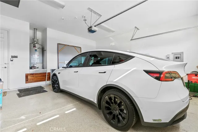 a bed room with a bed and a chandelier