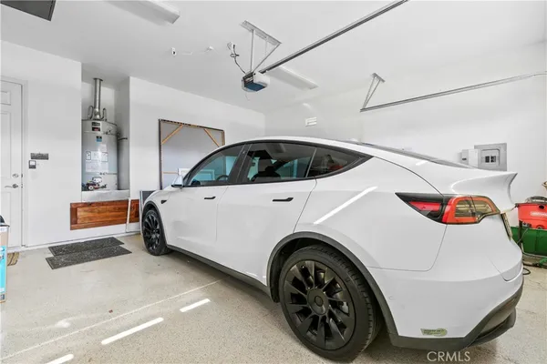 a view of a bedroom with furniture and window