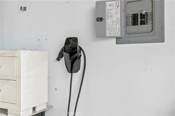 a bed room with a bed and a chandelier