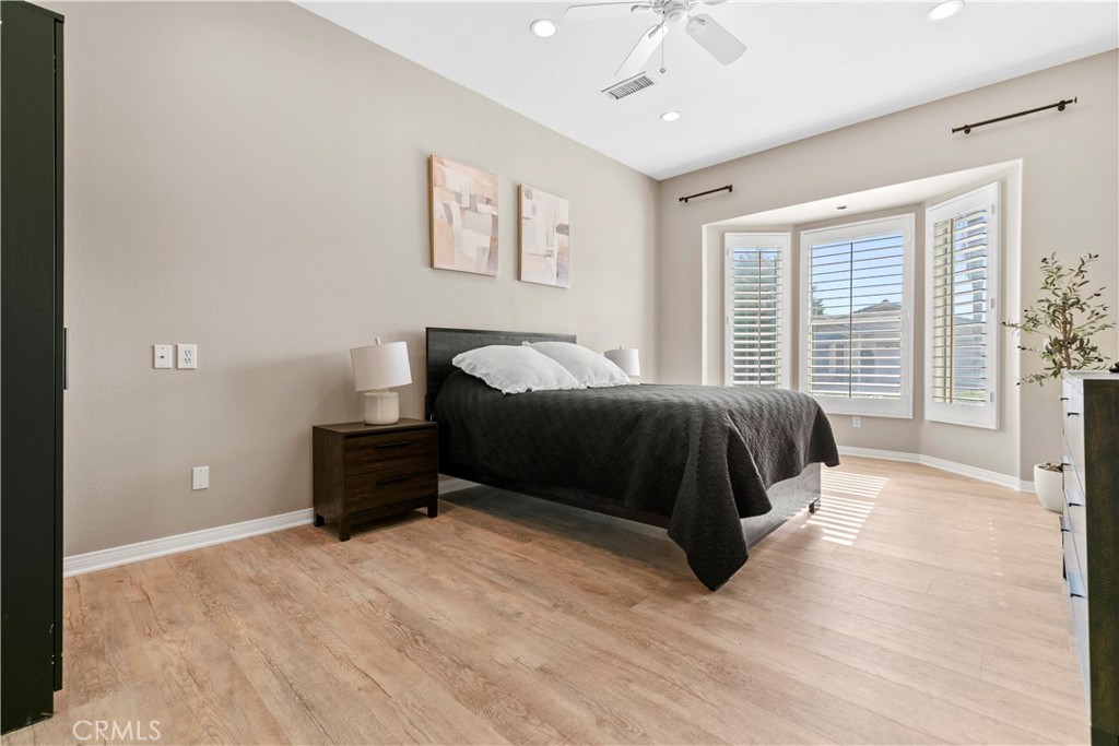 44 Killian Way Rancho Mirage, CA 92270 - Photo 28 of 72 a bedroom with a bed and a large window