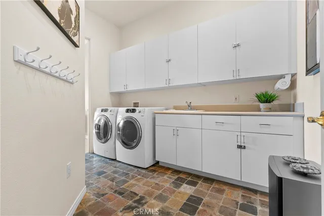 a spacious bathroom with a tub sink and mirror