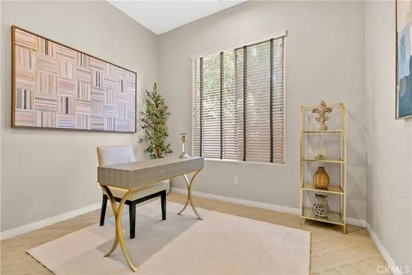 a spacious bedroom with a bed and a large window