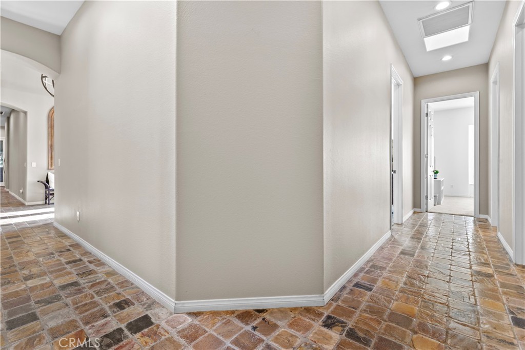 44 Killian Way Rancho Mirage, CA 92270 - Photo 43 of 72 a view of a hallway with wooden floor and a bathroom